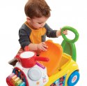 Jeździk Fisher Price Muzyczna Parada żółty